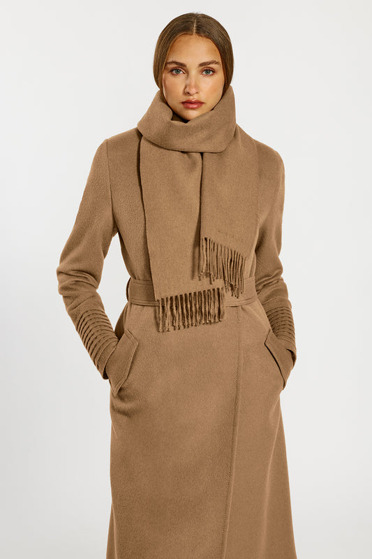 Sentaler Baby Alpaca Classic Scarf and the Long Notched Collar Wrap Coatcrafted in Baby Alpaca and in Dark Camel. Seen from front above the knees on female model. 