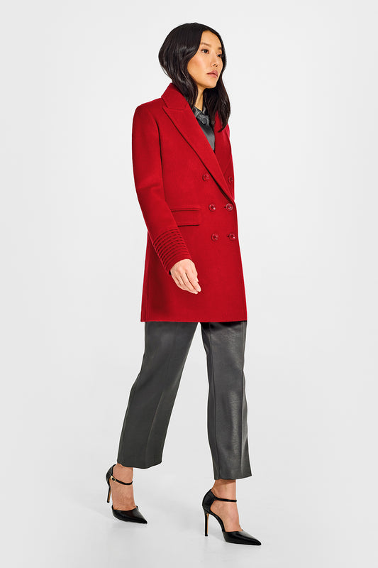 Sentaler Peak Collar Scarlet Red Topcoat in Baby Alpaca wool. Seen from side on female model.