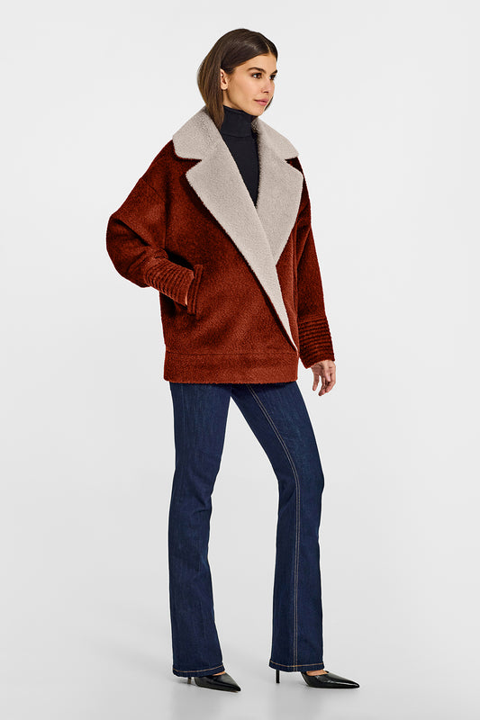 Sentaler Bouclé Alpaca Aviator Rust Jacket in Bouclé Alpaca wool. Seen from side on female model.