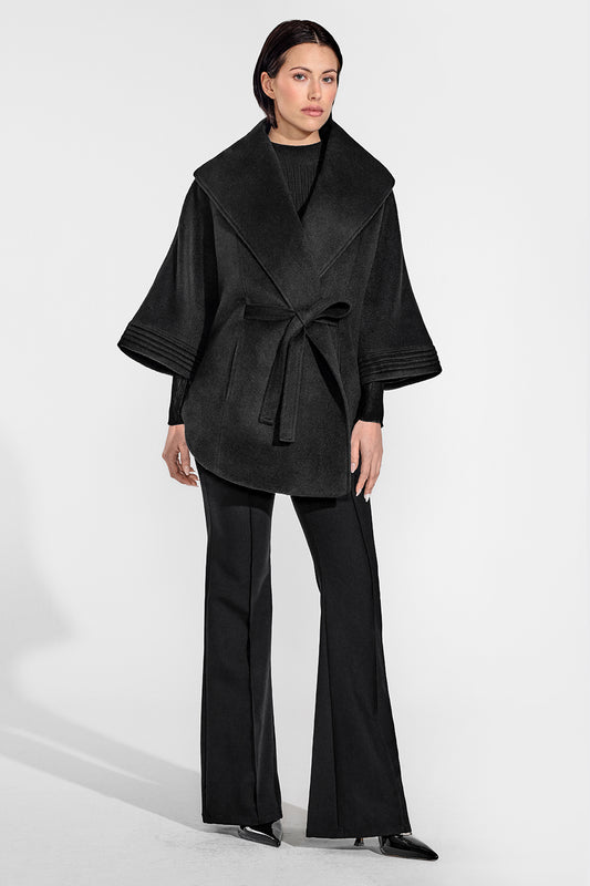 Sentaler Cape with Shawl Collar and Belt featured in Baby Alpaca and available in Black. Seen from front on female model who is wearing the coat belted.