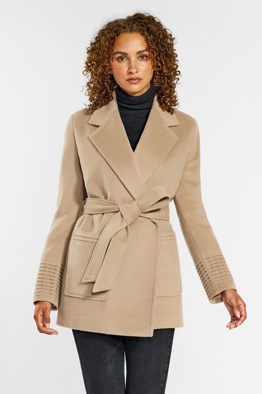 Sentaler Cropped Notched Collar Wrap Coat with Square Pockets crafted in Baby Alpaca and in Camel. Seen from front above the knees on female model wearing the coat belted.