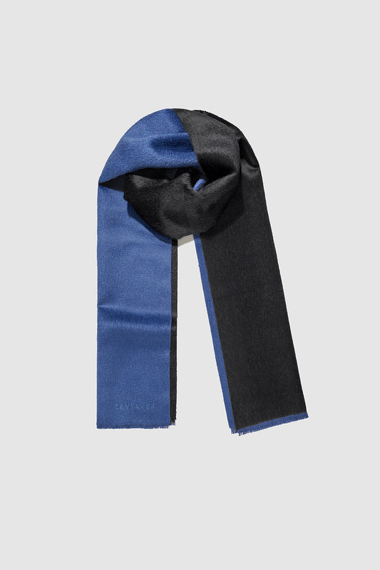 Sentaler Double Sided Suri Alpaca Scarf featured in Suri Alpaca and available in Black-Blue. Seen as off figure wrapped.