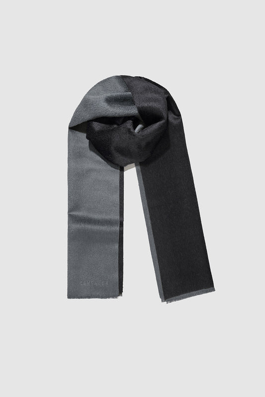 Sentaler Double Sided Suri Alpaca Scarf featured in Suri Alpaca and available in Black-Charcoal. Seen as off figure wrapped.