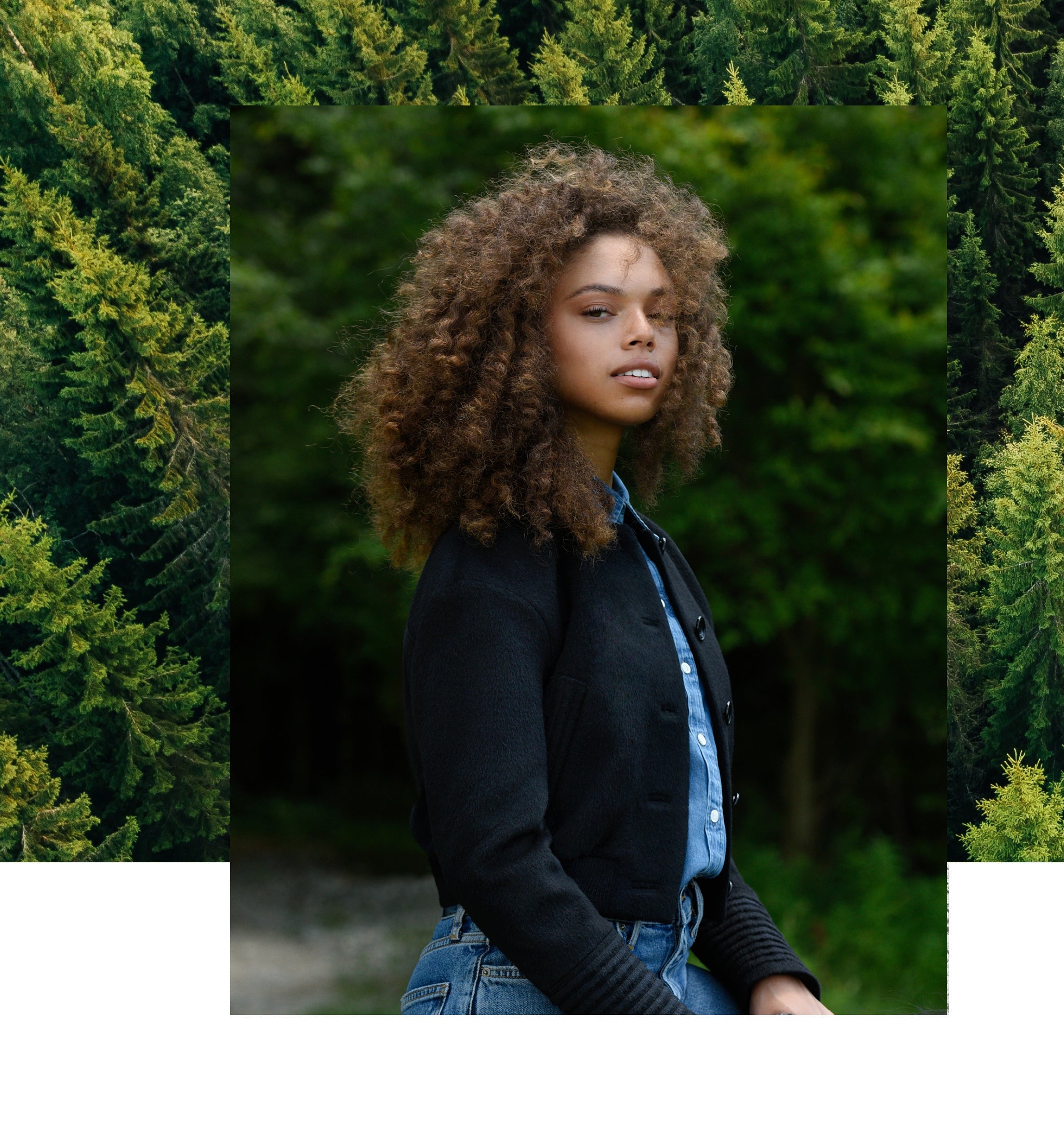 Sentaler Collarless Bomber Jacket with Knit Waistband featured in Baby Alpaca and available in Black. Seen from side on female model who is wearing the coat open.