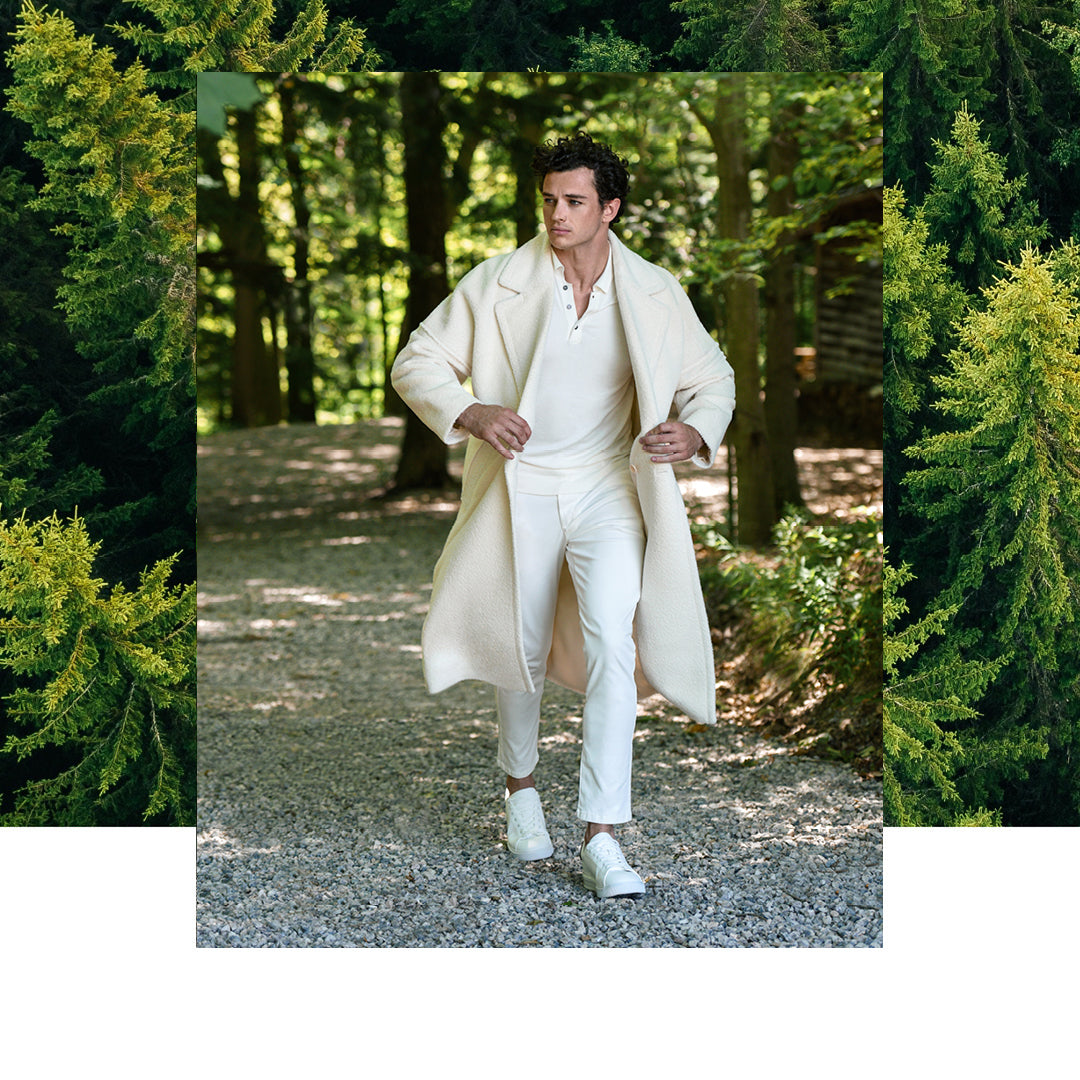 Sentaler Technical Bouclé Alpaca Robe Coat featured in Technical Bouclé Alpaca and available in Ivory. Seen from front on male model who is wearing the coat open and holding the collar.