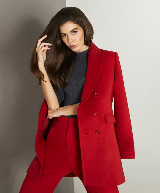 Sentaler Peak Collar Scarlet Red Topcoat in Baby Alpaca wool. Seen from front open above the knees on female model.