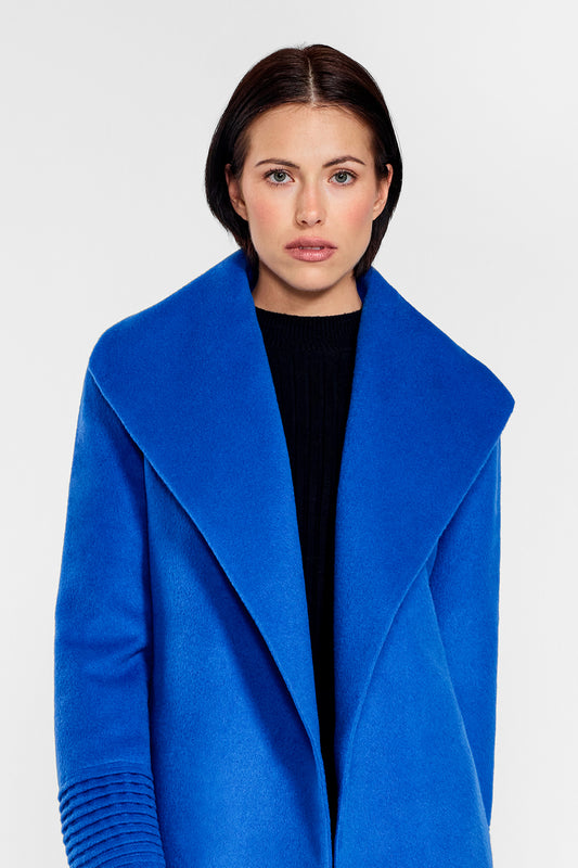Sentaler Mid Length Shawl Collar Wrap Coat crafted in Baby Alpaca wool and in Cobalt Blue. Seen from front open close up on female model.