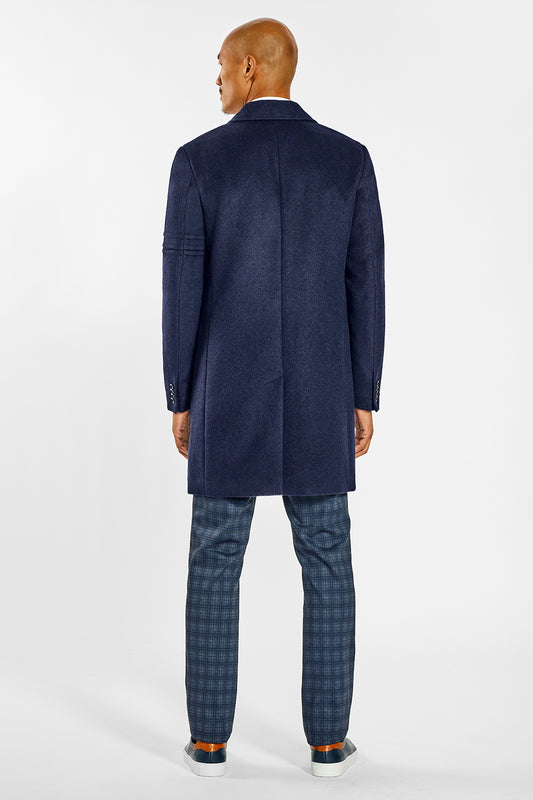 Sentaler Technical Baby Alpaca Notched Lapel Overcoat crafted in Technical Baby Alpaca and available in Deep Navy. Seen from back on male model.