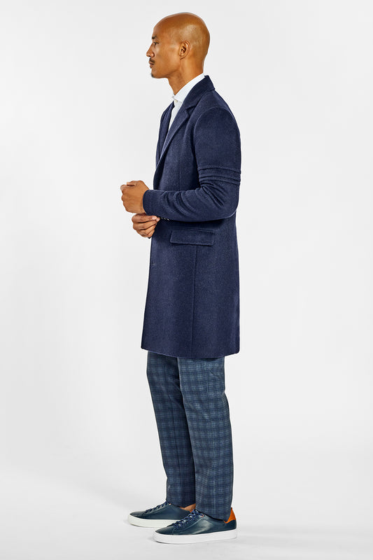 Sentaler Technical Baby Alpaca Notched Lapel Overcoat crafted in Technical Baby Alpaca and available in Deep Navy. Seen from side on male model.