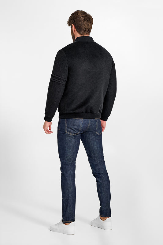 Sentaler Baby Alpaca Varsity Black Jacket in Technical Baby Alpaca wool. Seen from back on male model.
