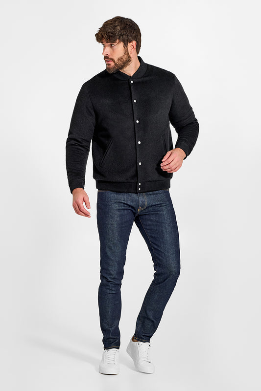 Sentaler Baby Alpaca Varsity Black Jacket in Technical Baby Alpaca wool. Seen from front on male model.