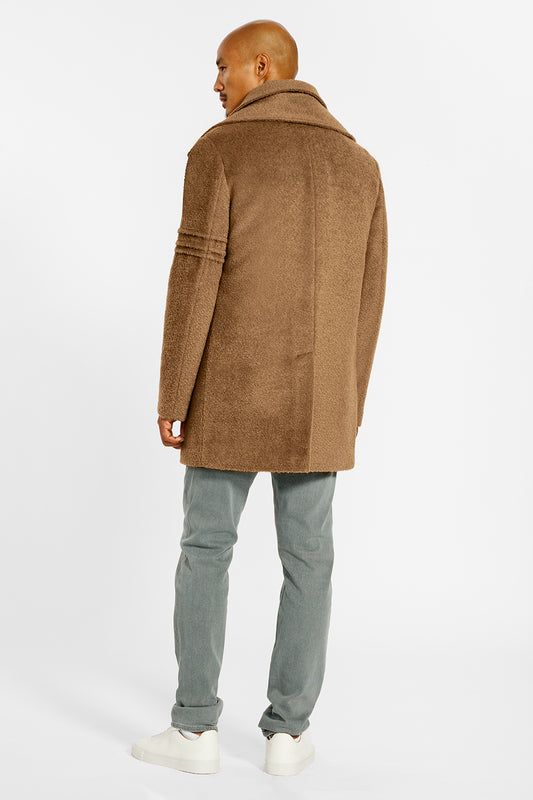 Sentaler Technical Bouclé Alpaca Double Collar Topcoat crafted in Technical Bouclé Alpaca and available in Dark Camel. Seen from back on male model.