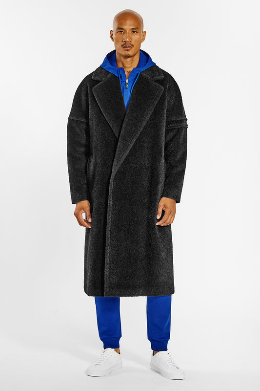 Sentaler Technical Bouclé Alpaca Robe Coat crafted in Technical Bouclé Alpaca and available in Black. Seen from front on male model.