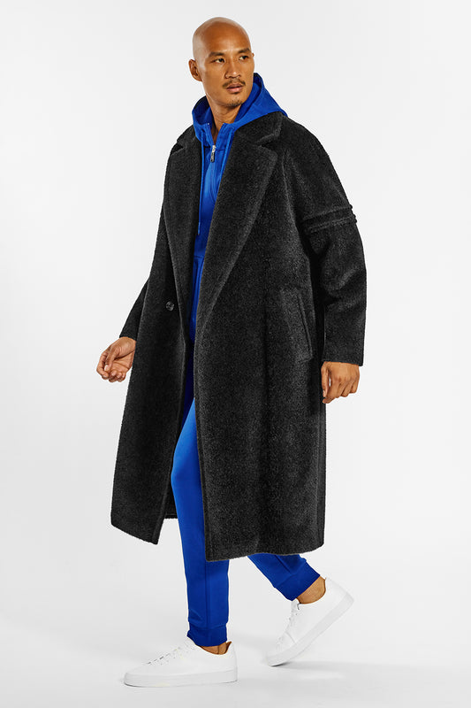 Sentaler Technical Bouclé Alpaca Robe Coat crafted in Technical Bouclé Alpaca and available in Black. Seen from side open on male model.