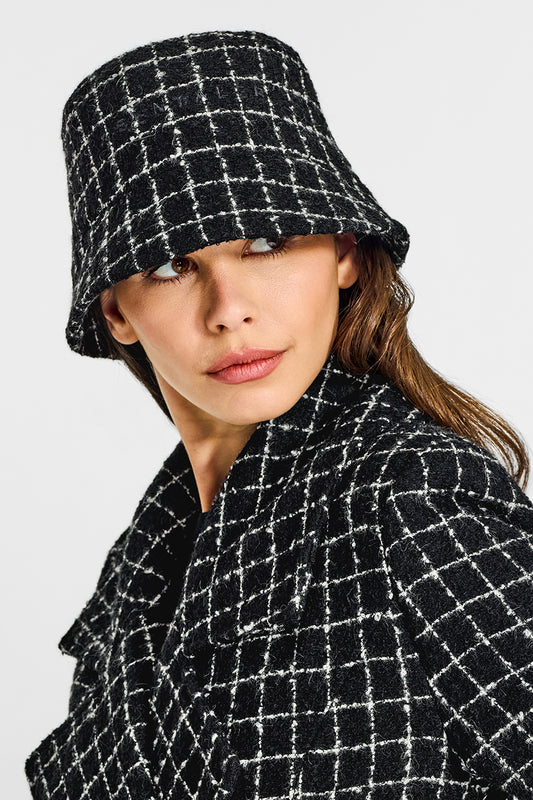 Sentaler Tweed Black Check Bucket Hat in Tweed Suri Alpaca wool. Seen from front close up on female model.