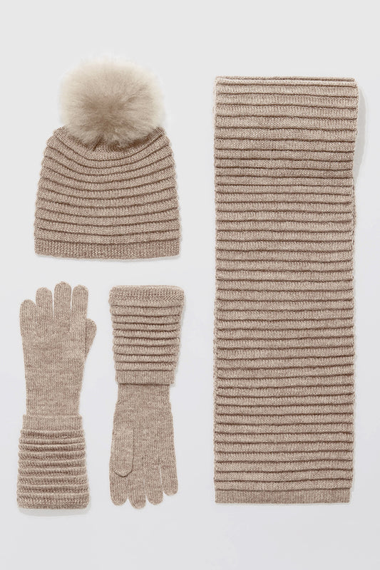 Sentaler Adult Ribbed Hat With Oversized Fur Pompon featured in Baby Alpaca and available in Light Taupe. Seen with scarf and gloves off model.