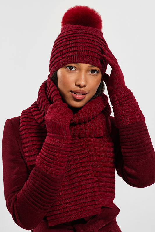 Sentaler Adult Ribbed Hat With Oversized Fur Pompon featured in Baby Alpaca and available in Garnet Red. Seen with scarf and gloves from front.