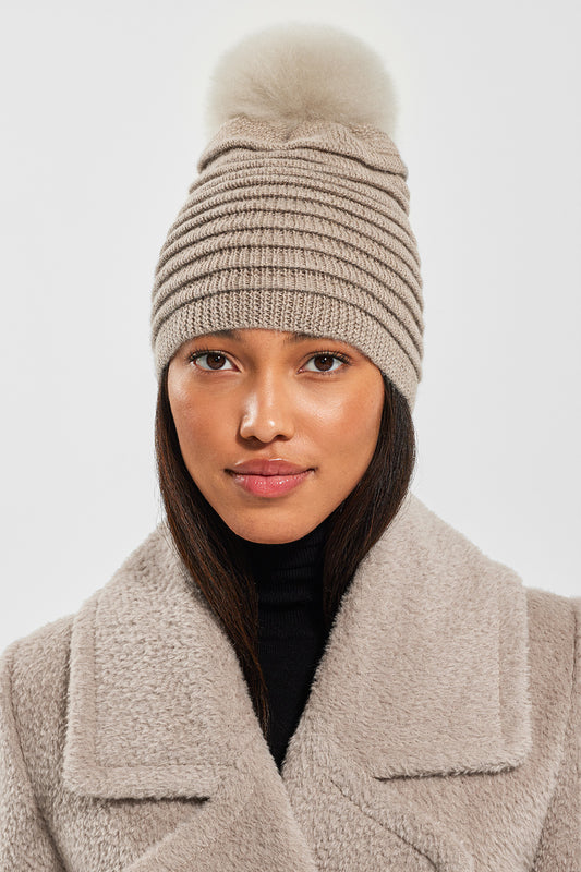 Sentaler Adult Ribbed Hat With Oversized Fur Pompon featured in Baby Alpaca and available in Light Taupe. Seen from front close-up.