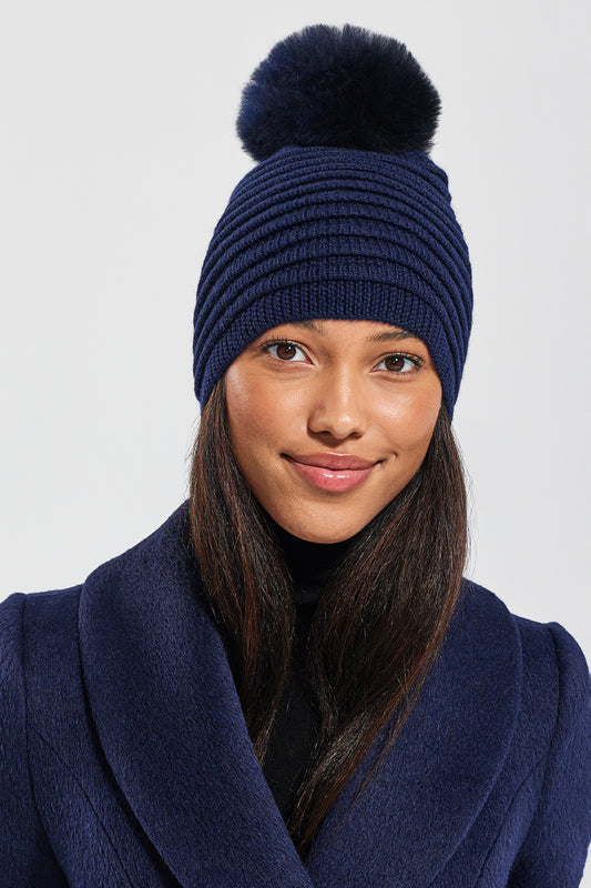 Sentaler Adult Ribbed Hat With Oversized Fur Pompon featured in Baby Alpaca and available in Navy. Seen from front close up 1.