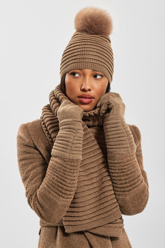 Sentaler Adult Ribbed Hat With Oversized Fur Pompon featured in Baby Alpaca and available in Dark Camel. Seen from front.