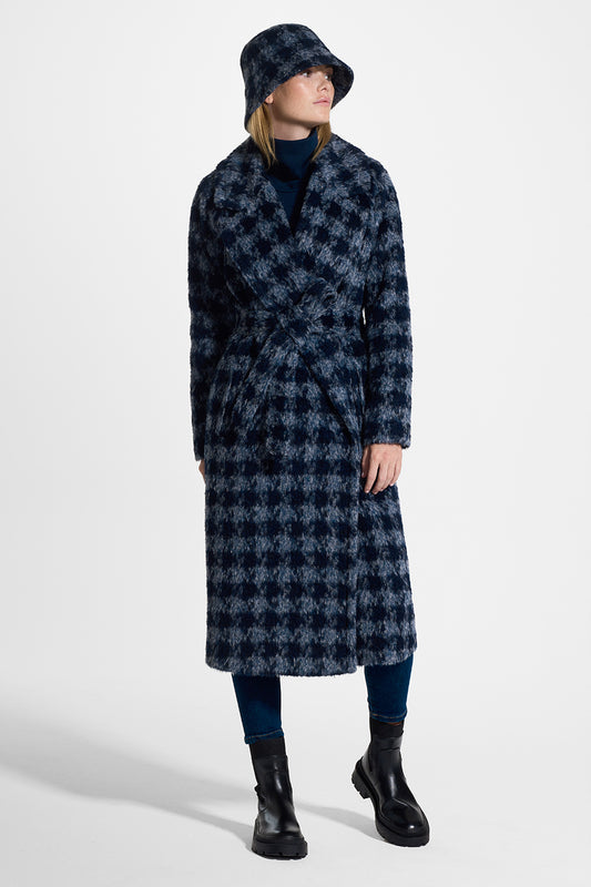 Sentaler Houndstooth Suri Alpaca Bucket Hat featured in Suri Alpaca and available in Navy Houndstooth. Seen from side on model.
