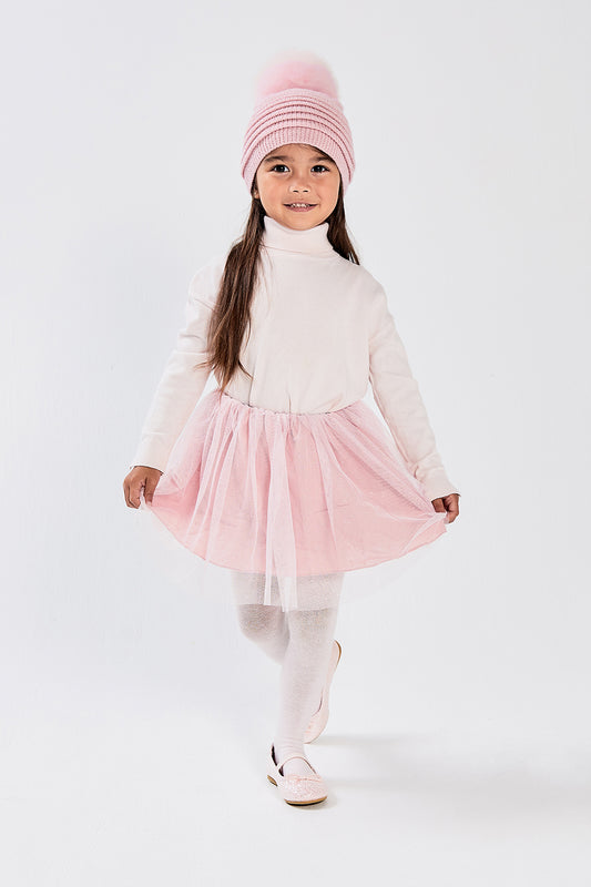 Sentaler Kids (1-5 Years) Ribbed Hat with Oversized Fur Pompon featured in Baby Alpaca and available in Pink. Seen from front on model.