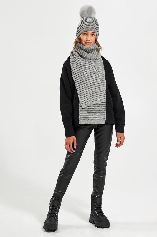 Sentaler Kids (6-14 Years) Ribbed Hat with Oversized Fur Pompon featured in Baby Alpaca and available in Grey. Seen from front on model with Ribbed Scarf in Grey.