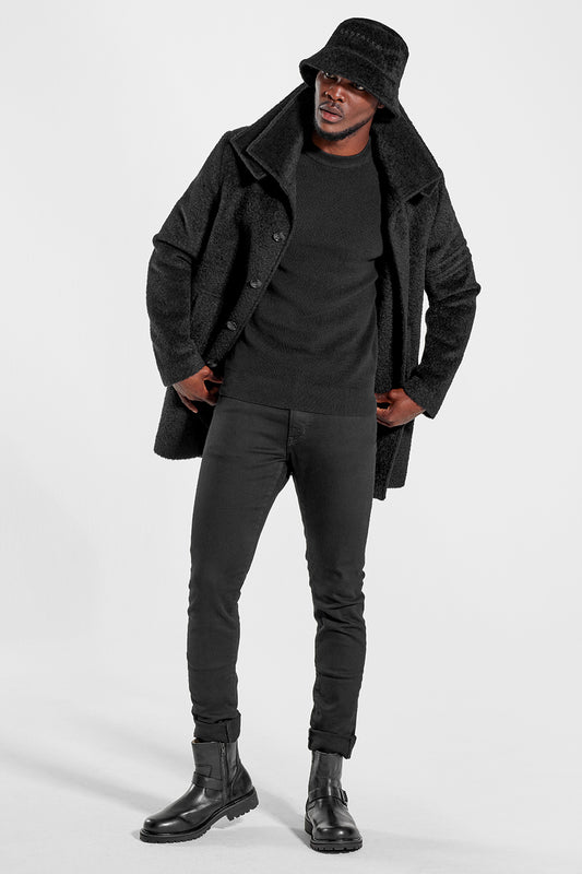 Sentaler Mens Bouclé Alpaca Bucket Hat featured in Bouclé Alpaca and available in Black. Seen from front on model.