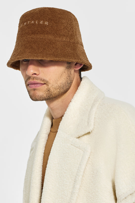 Sentaler Mens Bouclé Alpaca Bucket Hat featured in Bouclé Alpaca and available in Caramel Café. Seen from side close up on model.