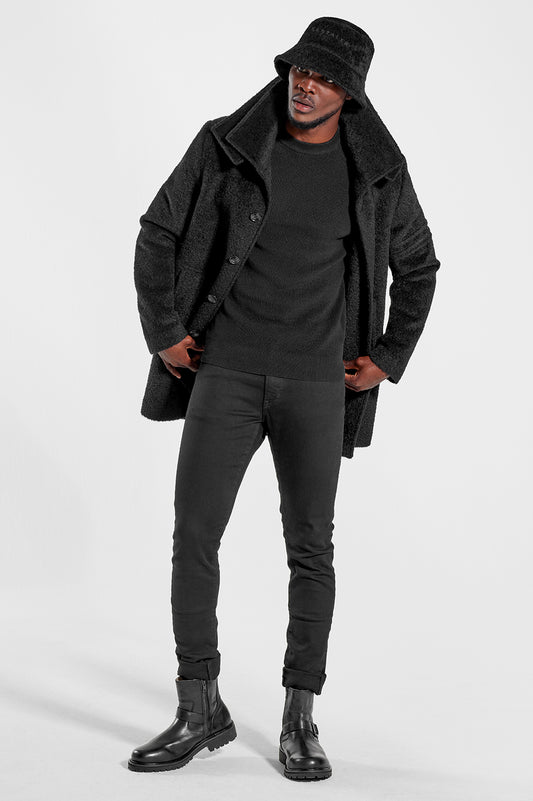 Sentaler Technical Baby Alpaca Notched Lapel Overcoat and Bouclé Alpaca Bucket Hat featured in Technical Baby Alpaca and available in Black. Seen from front open.