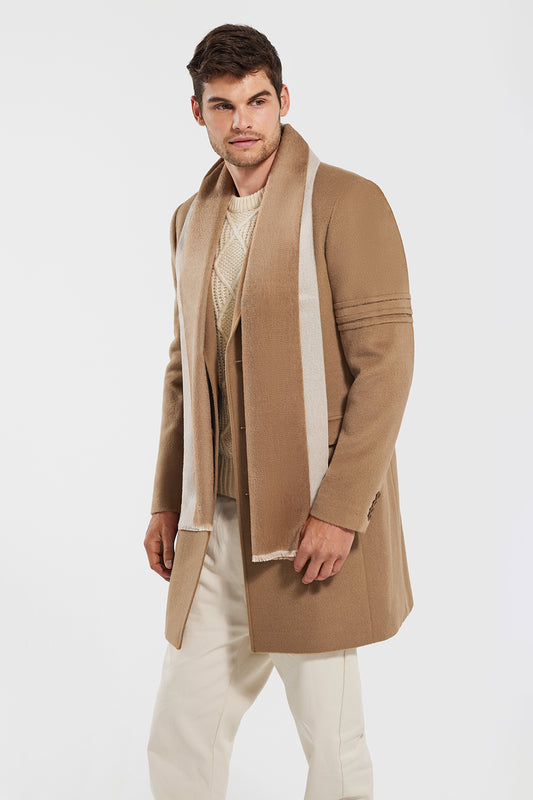 Sentaler Technical Baby Alpaca Notched Lapel Overcoat featured in Technical Baby Alpaca and available in Dark Camel and Double Sided Suri Alpaca Scarf featured in Suri Alpaca in Dark Camel/Light Taupe. Seen from side open.