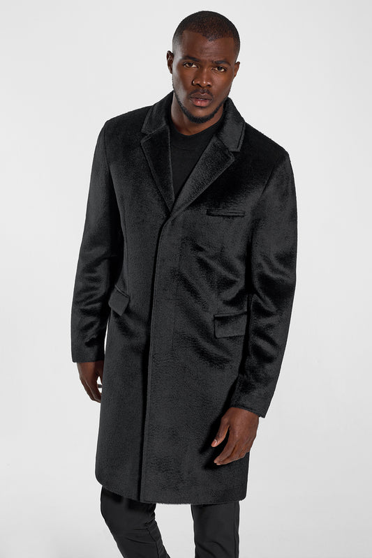 Sentaler Technical Suri Alpaca Notched Lapel Overcoat featured in Technical Suri Alpaca and available in Black. Seen from front above the knees on model.